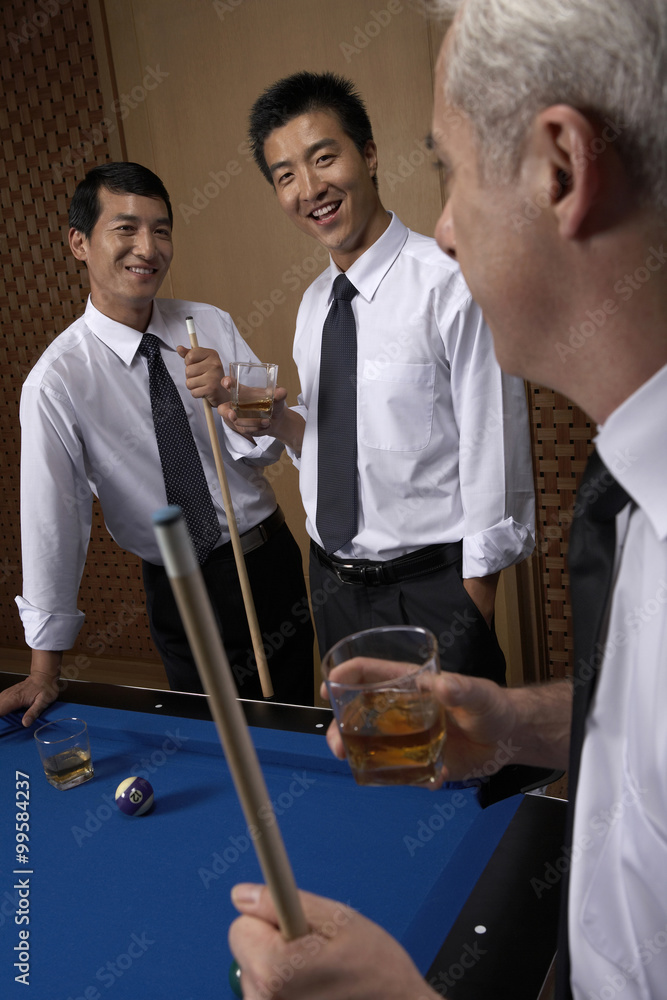 Professionals toast over billiards