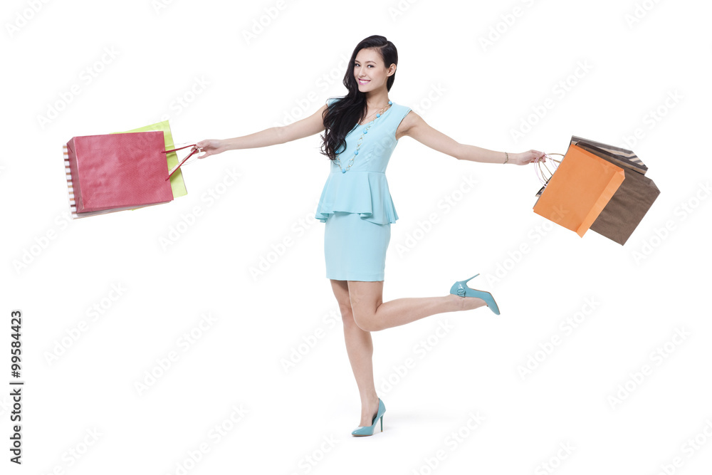 Stylish young woman shopping happily