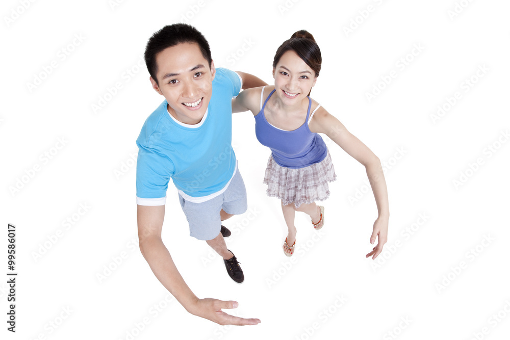 Happy young couple opening arms