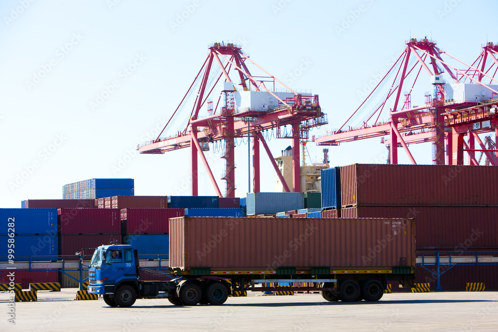 Cranes and cargo containers in shipping dock