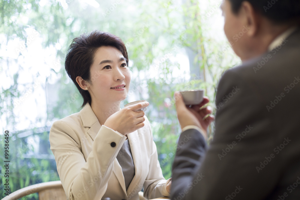 Business person discussing in tea room