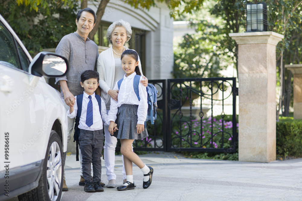 Portrait of senior couple and their grandchildren