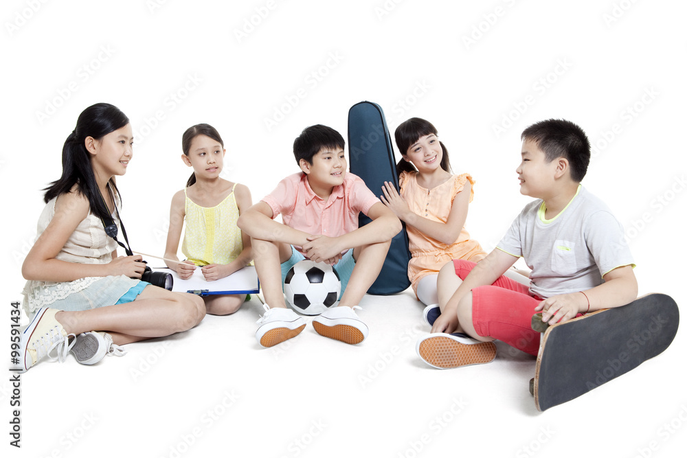 Merry children sitting on the floor and their leisure hobbies