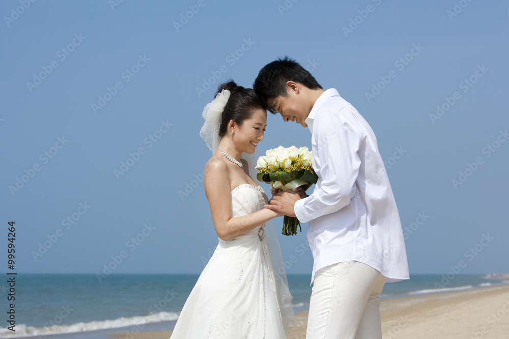 Newlywed couple on the beach