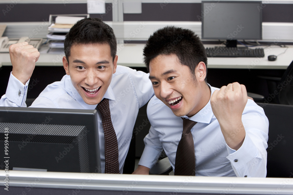 Two Businessmen Cheering