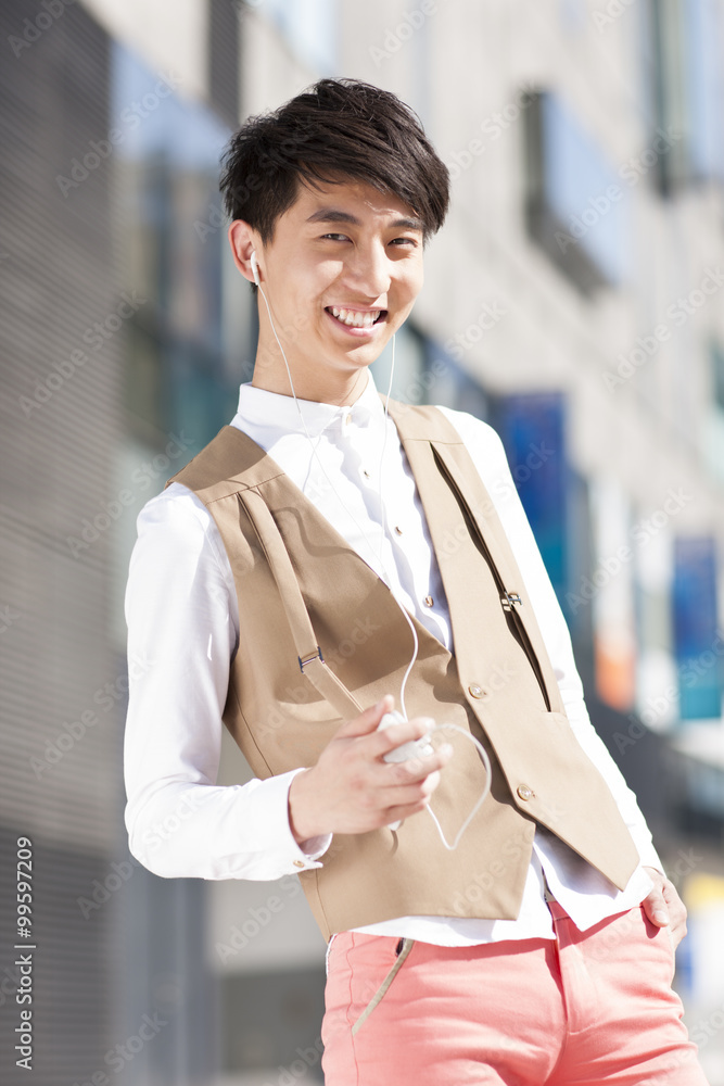 Stylish young man enjoying music