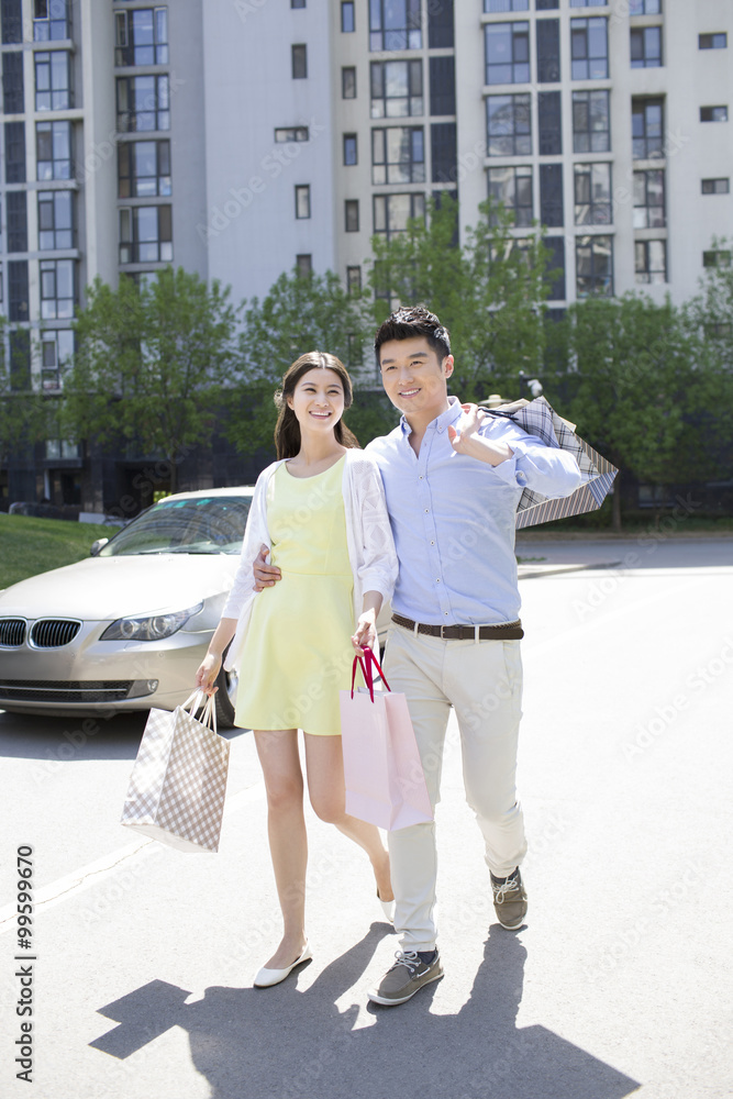 Happy young couple shopping