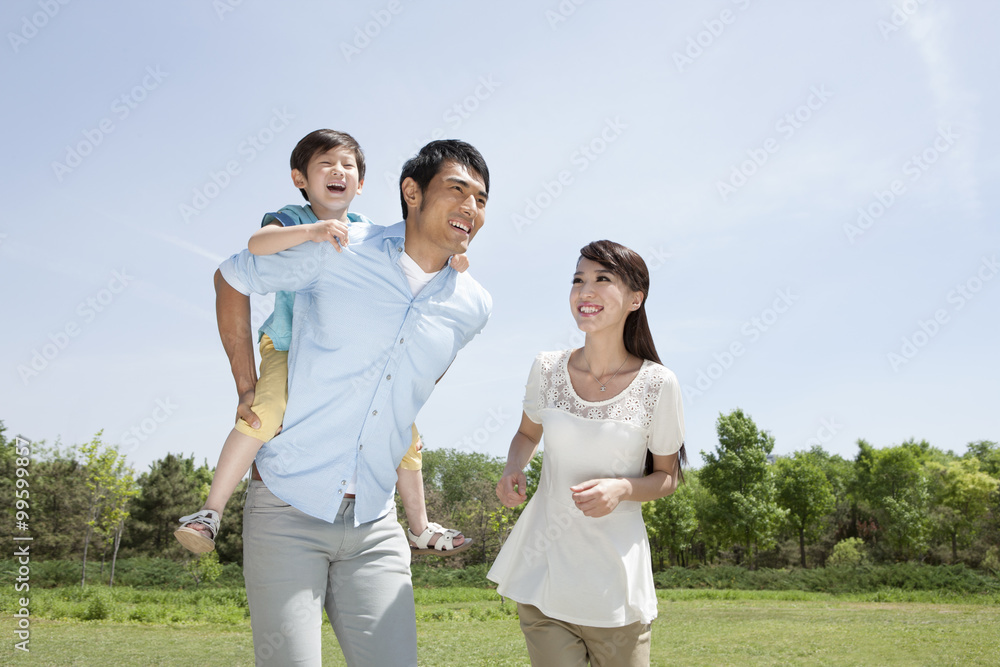 Young family playing outdoors