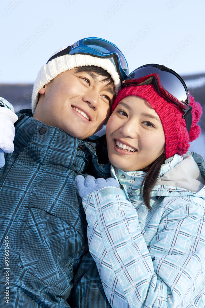 Young couple in skiing resort