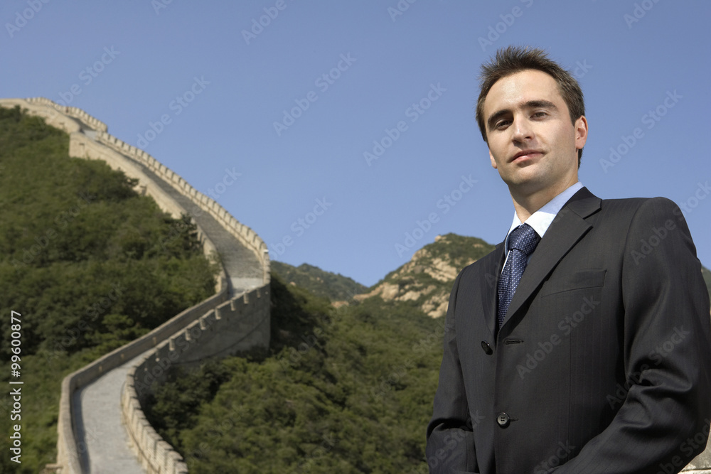 Businessman Standing On The Great Wall Of China