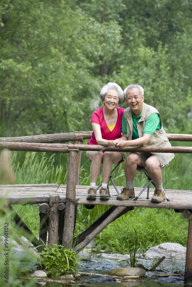 Portrait of senior couple fishing