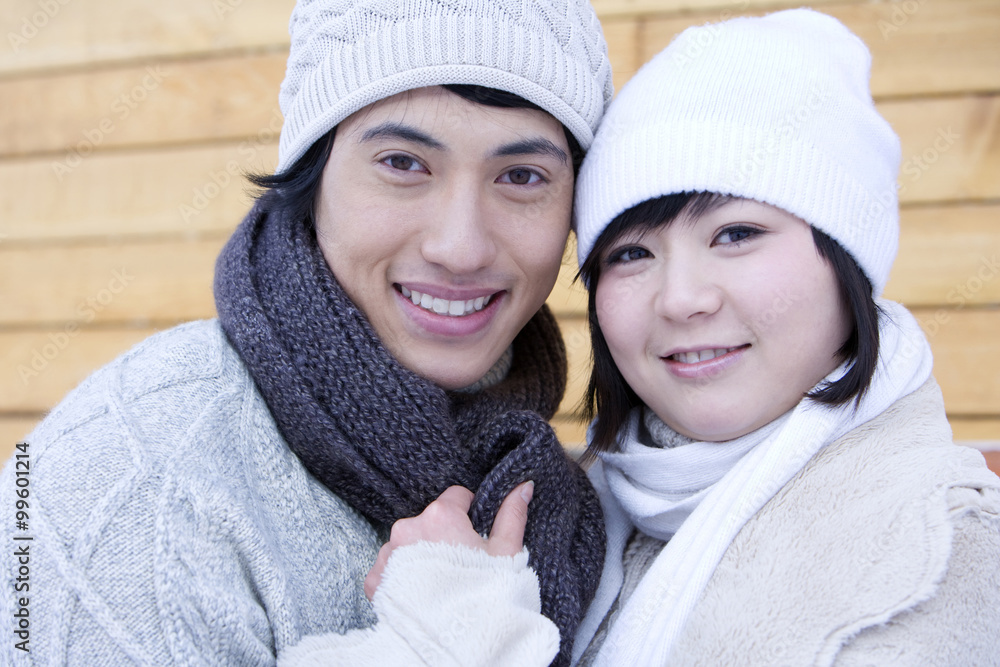 Young couple smiling into the camera