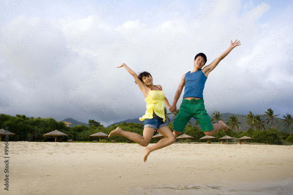 Young couple having fun at the beach