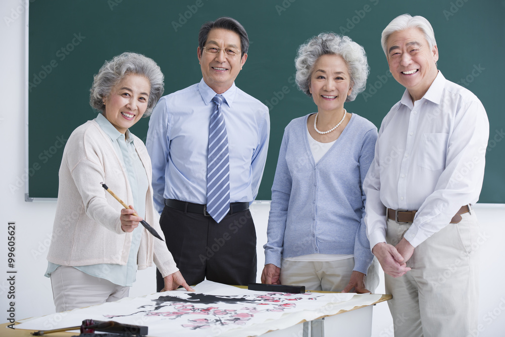 Senior adults having art class at school