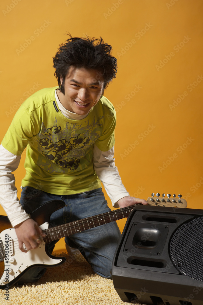 Teenager Playing Guitar