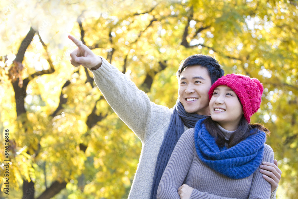 Young Couple Enjoying a Park in Autumn