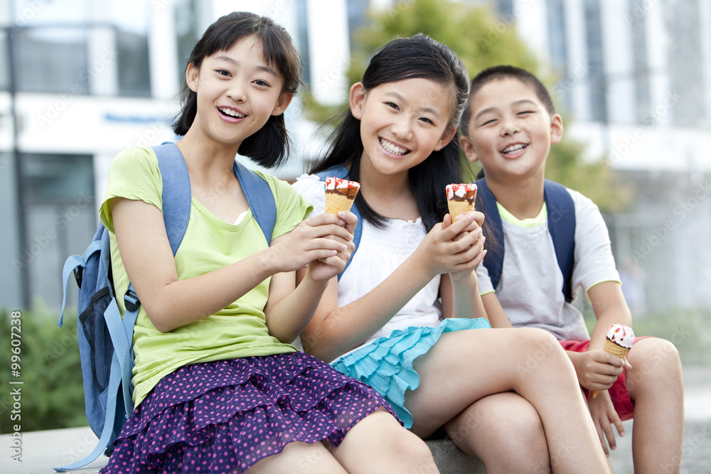 Happy schoolchildren and ice cream cones