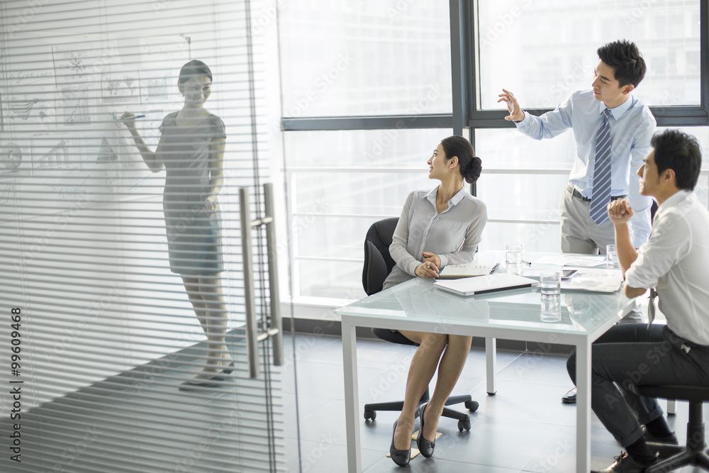 Young business people talking in meeting