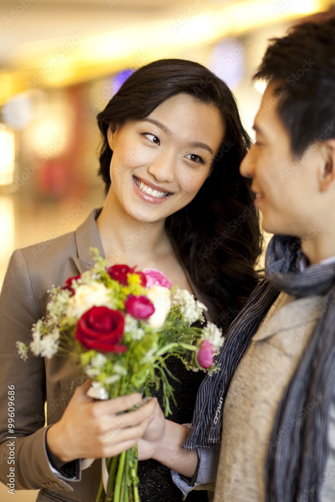 Young couple with flowers