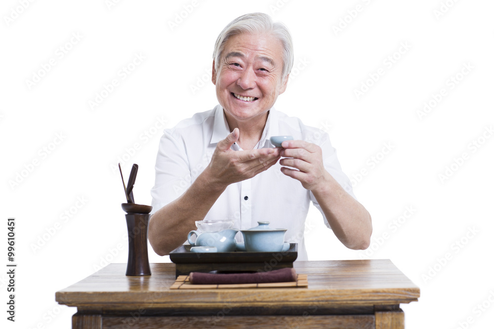 Happy senior man having tea