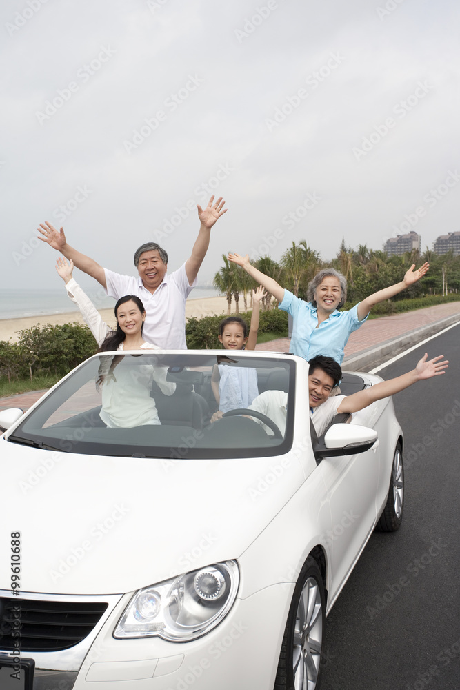 Happy Family Driving in a Convertible