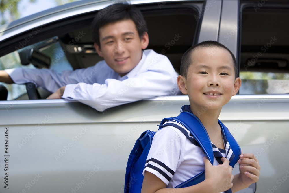 Father dropping son off at school