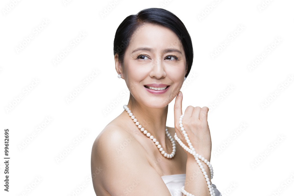 Beautiful mature woman with pearl jewelries