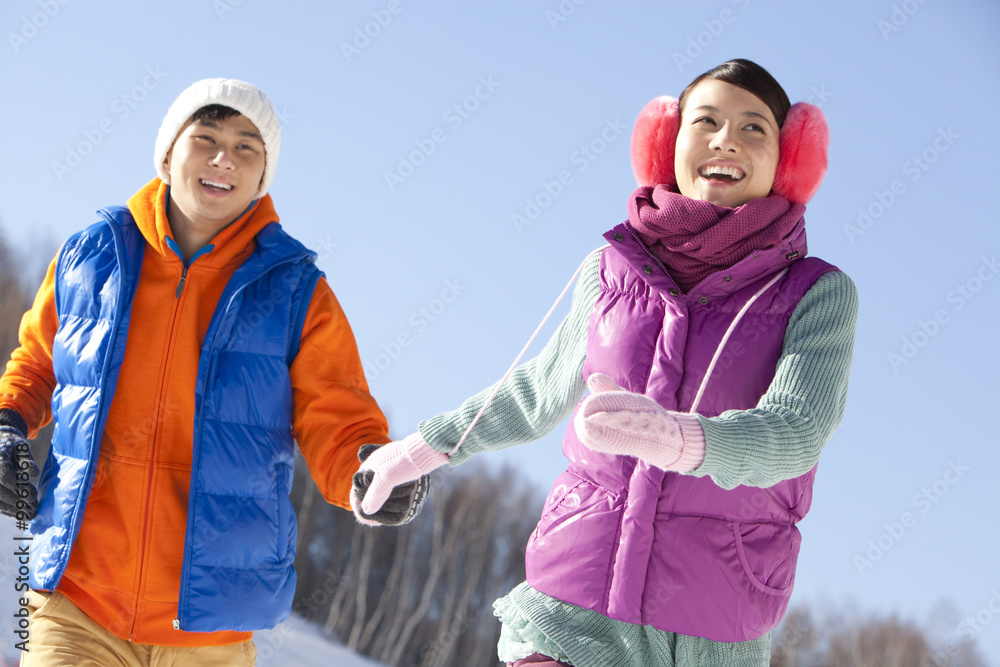 Happy young couple in ski resort