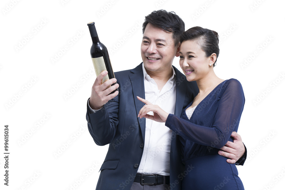 Happy couple with a bottle of wine