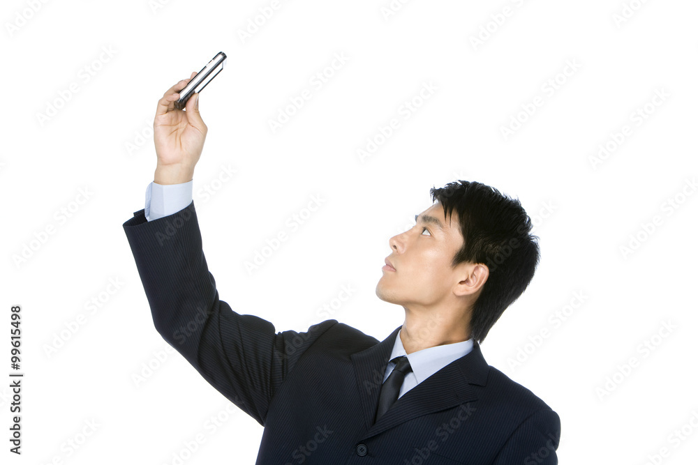 Young Businessman looking at cell phone