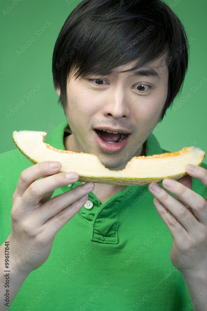 Man in green with melon