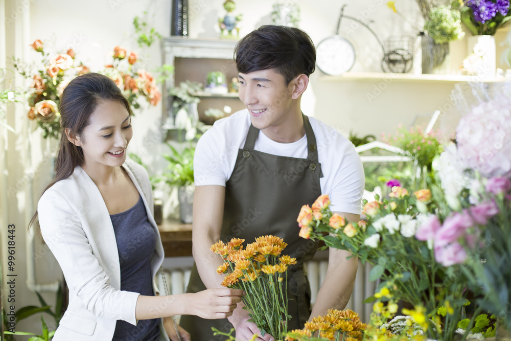 Florist and customer in flower shop