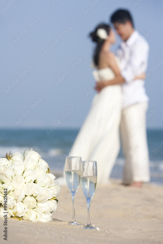 Newlyweds celebrating on the beach