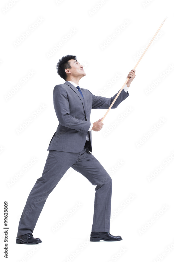 Businessman with pole in hand