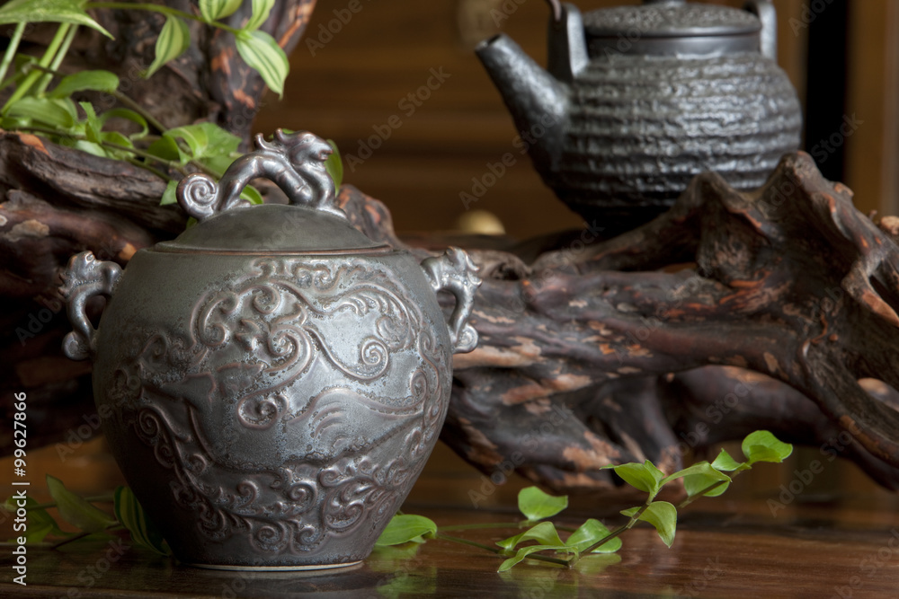 Close up of Chinese tea caddy and tea kettle