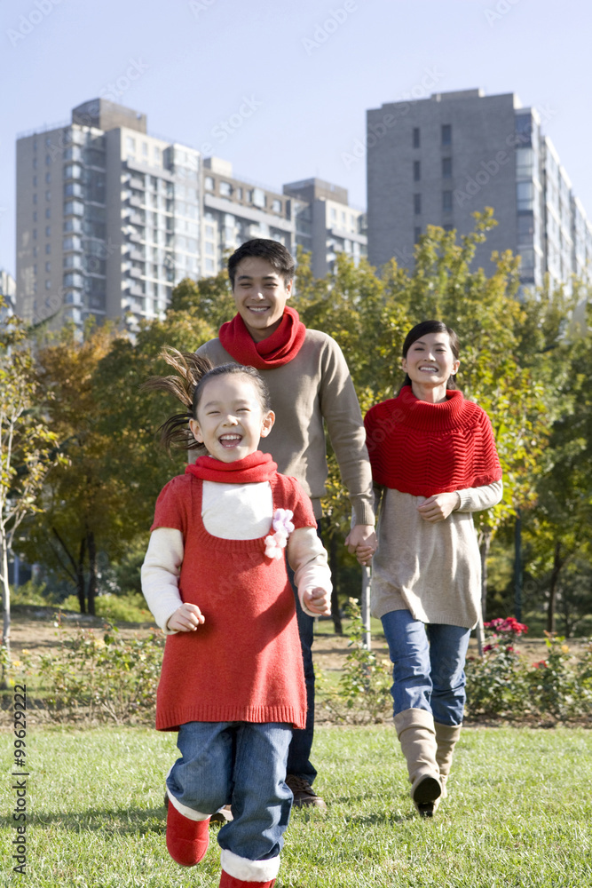 Young Family Enjoying a Park in Autumn