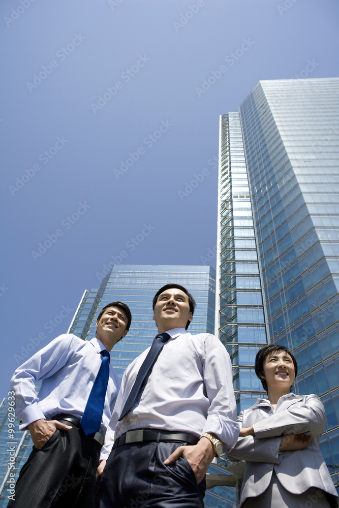 Businesspeople in front of a office tower