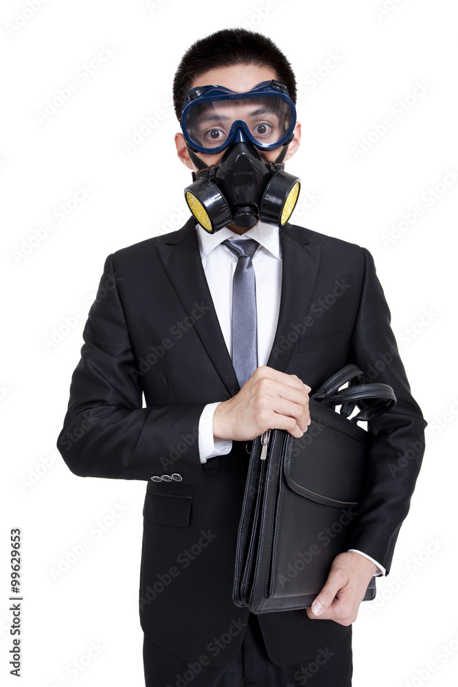 Businessman wearing gas mask