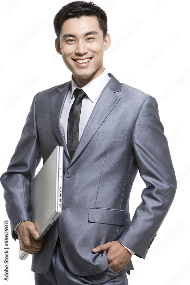 Businessman holding laptop