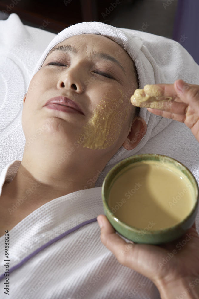 Woman Having A Facial Mask Applied