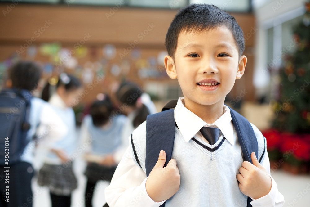 Young student standing confidently in the foreground