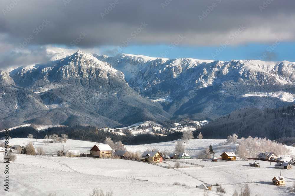 Sunny day of a winter, on wild transylvania hills with Bucegi mountains in background.. 09.01.2016. 