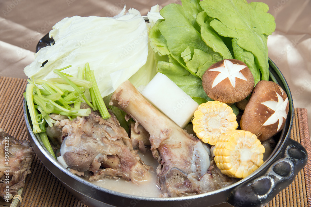 Chinese New Years dinner Big Bone maize mushroom vegetable pot