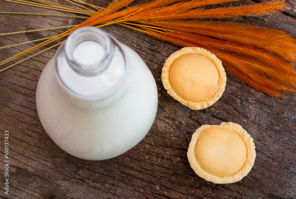 Mini pie apple with bottle of milk , top view