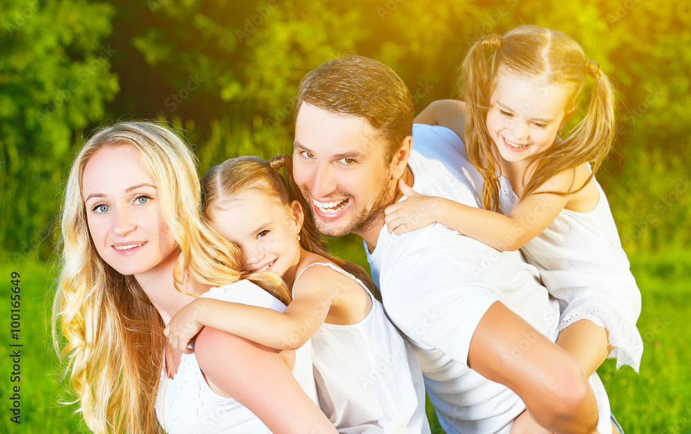 happy family on nature of summer, mother, father and children tw