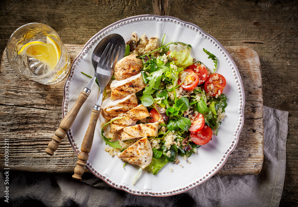 Quinoa and vegetable salad and grilled chicken