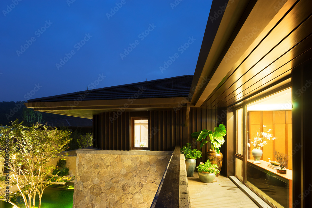 balcony in modern villa in blue sky at night