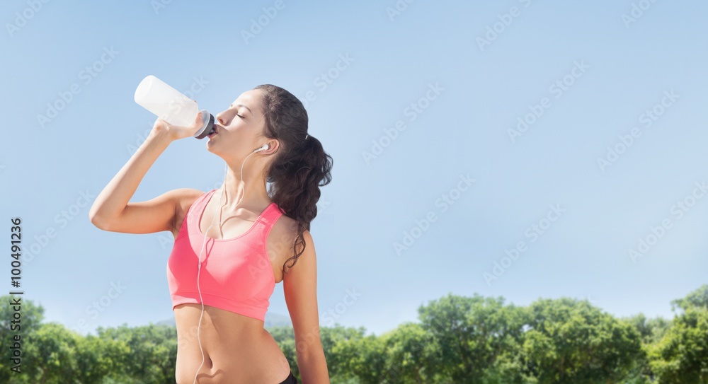 Composite image of beautiful healthy woman drinking water