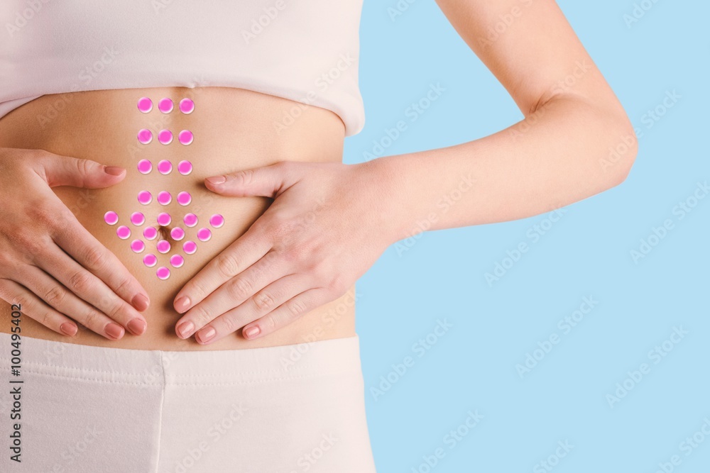 Composite image of slim woman touching her belly