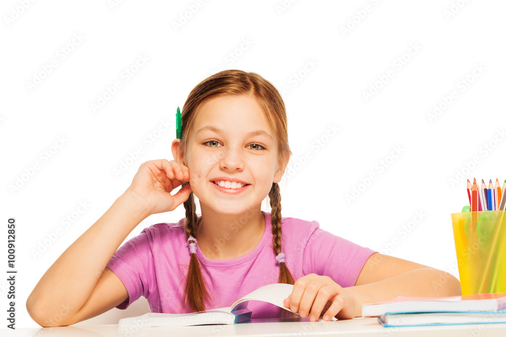 Funny schoolgirl with pencil behind her ear